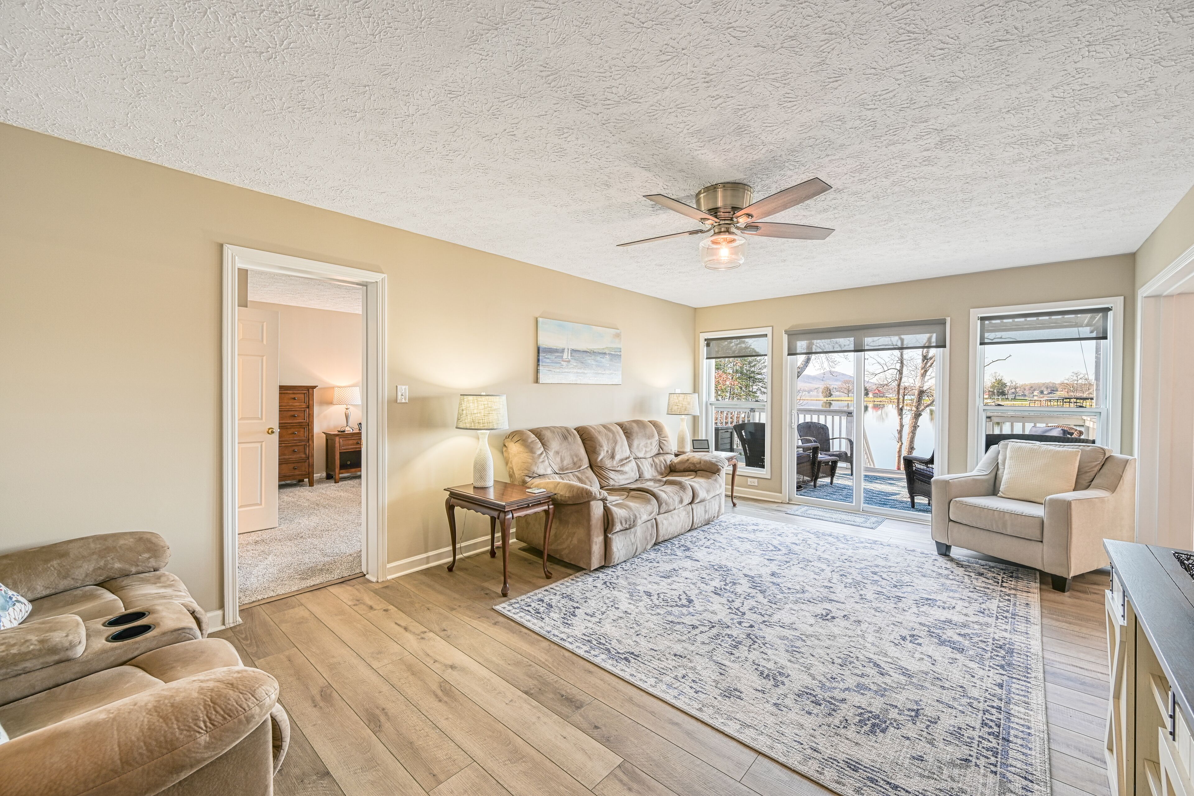 Serene lakefront home with dock, patio, grill, hot tub, pool table, & W/D