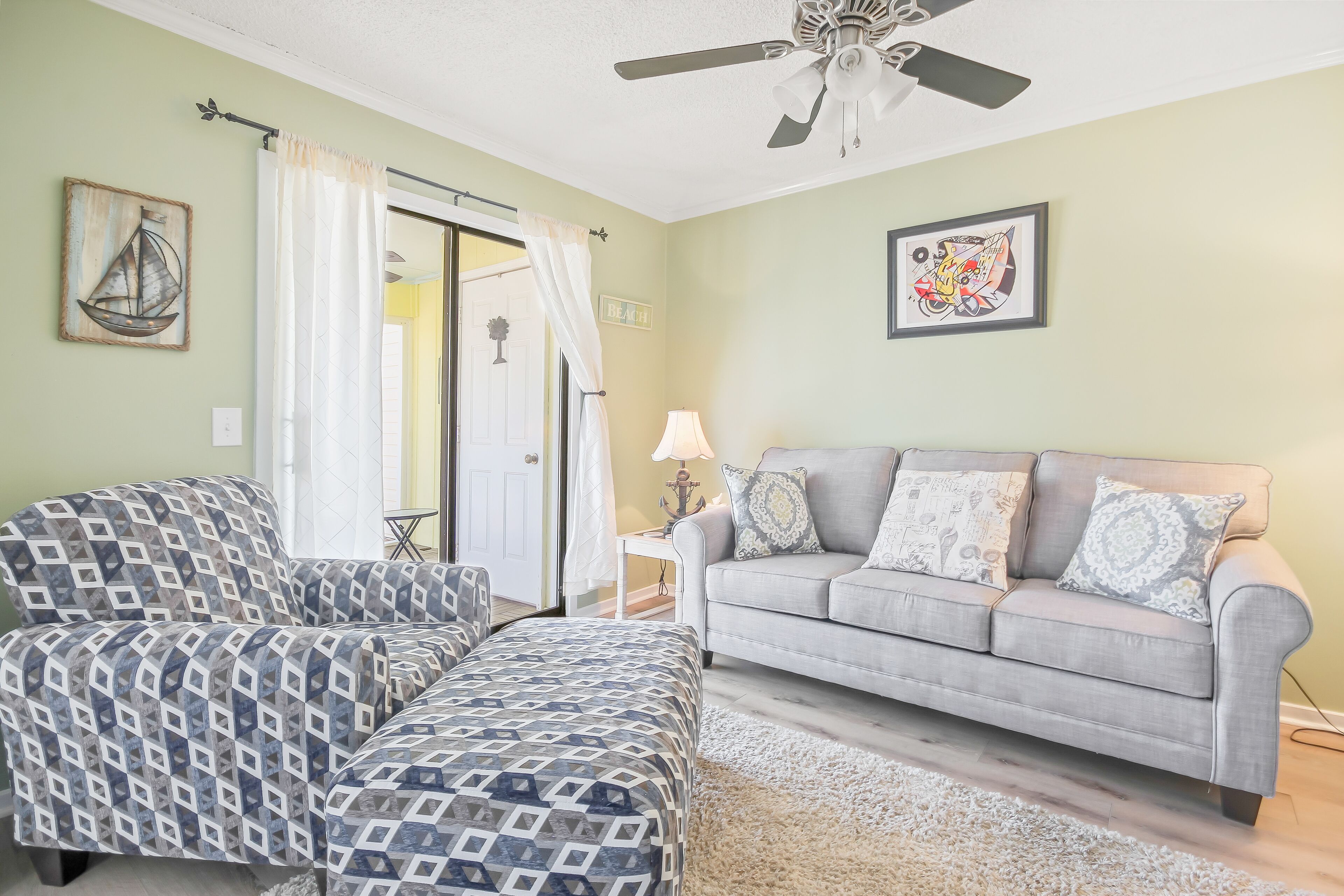 Updated dog-friendly condo with water views, pool, & deck