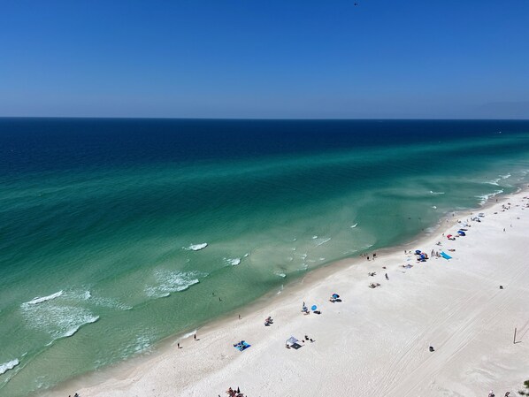 On the beach, sun loungers, beach towels