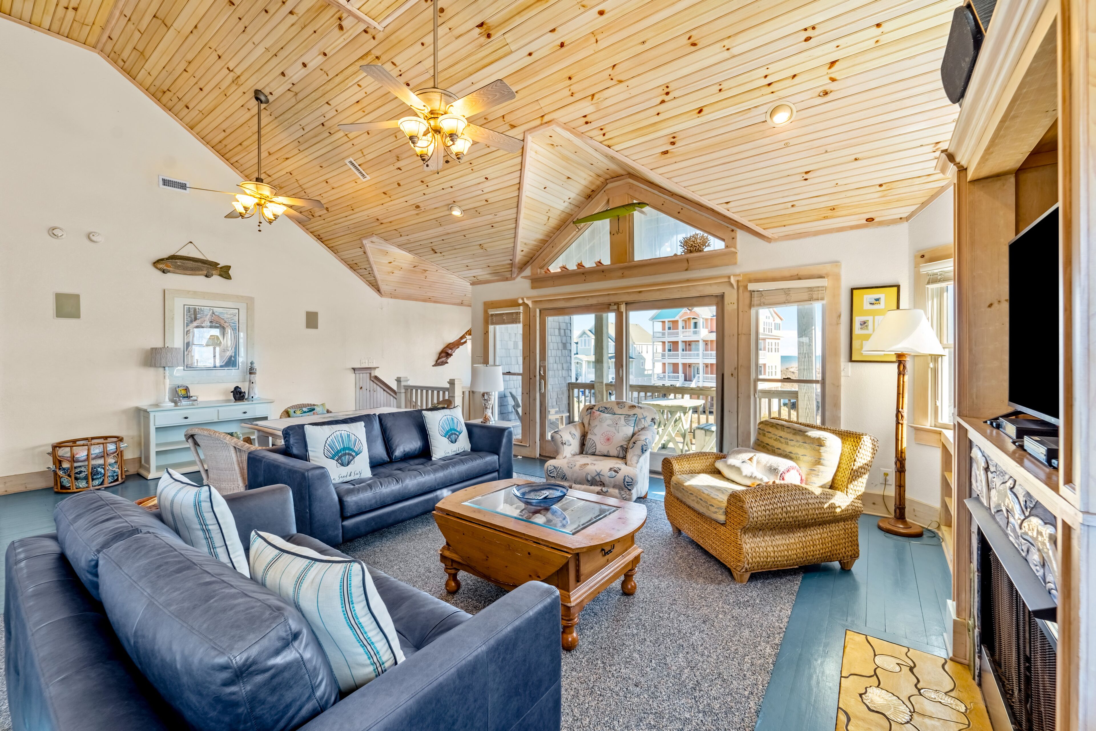 Sprawling & luxe home with a pool, hot tub, balconies, grill, game room, and AC