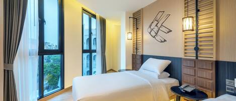 Habitación triple Deluxe | Vistas a la ciudad