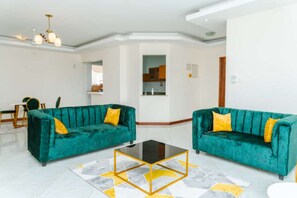 Comfort Apartment, 3 Bedrooms | Living area | 24-inch flat-screen TV with digital channels, TV - Links Apartments Nyali by CHH (Mombasa)