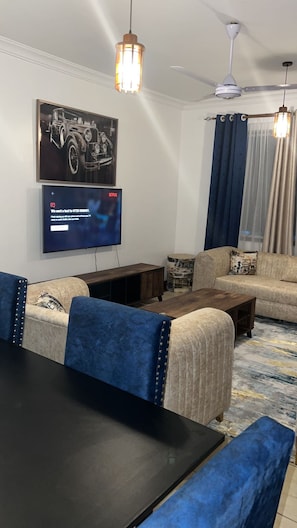 Apartment, 1 Bedroom | Living room | 24-inch flat-screen TV with digital channels, TV
