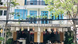 A two-story building with a coffee shop on the ground floor. - An's family homestay (Da Nang)
