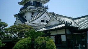 A traditional Japanese castle with multiple tiers and a prominent central tower. - En Hostel Bar & Community Lounge (Kochi)