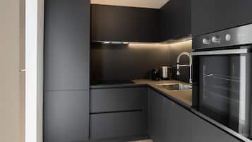 Apartment Primo Piano | Cucina privata | Frigorifero, microonde, forno, piano cottura