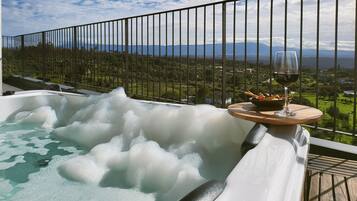Suite with Balcony and Exterior jetted tub with Mountain View | Garden view