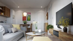Ein modernes Wohnzimmer mit einer Couch, einem Couchtisch und Zimmerpflanzen.