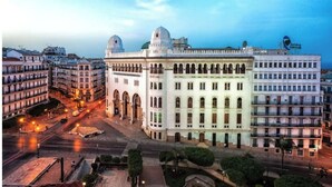 A large, historic building with multiple floors, arched windows, and a central dome. - Great studio in El-Biar (Algiers)