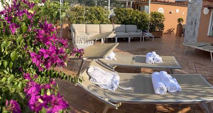 Two Double rooms with private bathrooms and an equipped roof terrace.