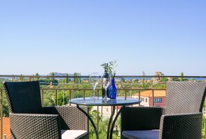 Enjoy a romantic dinner for two on this balcony overlooking the scenic coastal town.