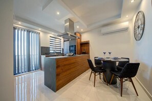 Deluxe Apartment | Private kitchen | Full-size fridge, microwave, oven, toaster - Central Apartments (St. Paul's Bay)