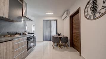 Superior Apartment | Private kitchen | Full-size fridge, microwave, oven, toaster