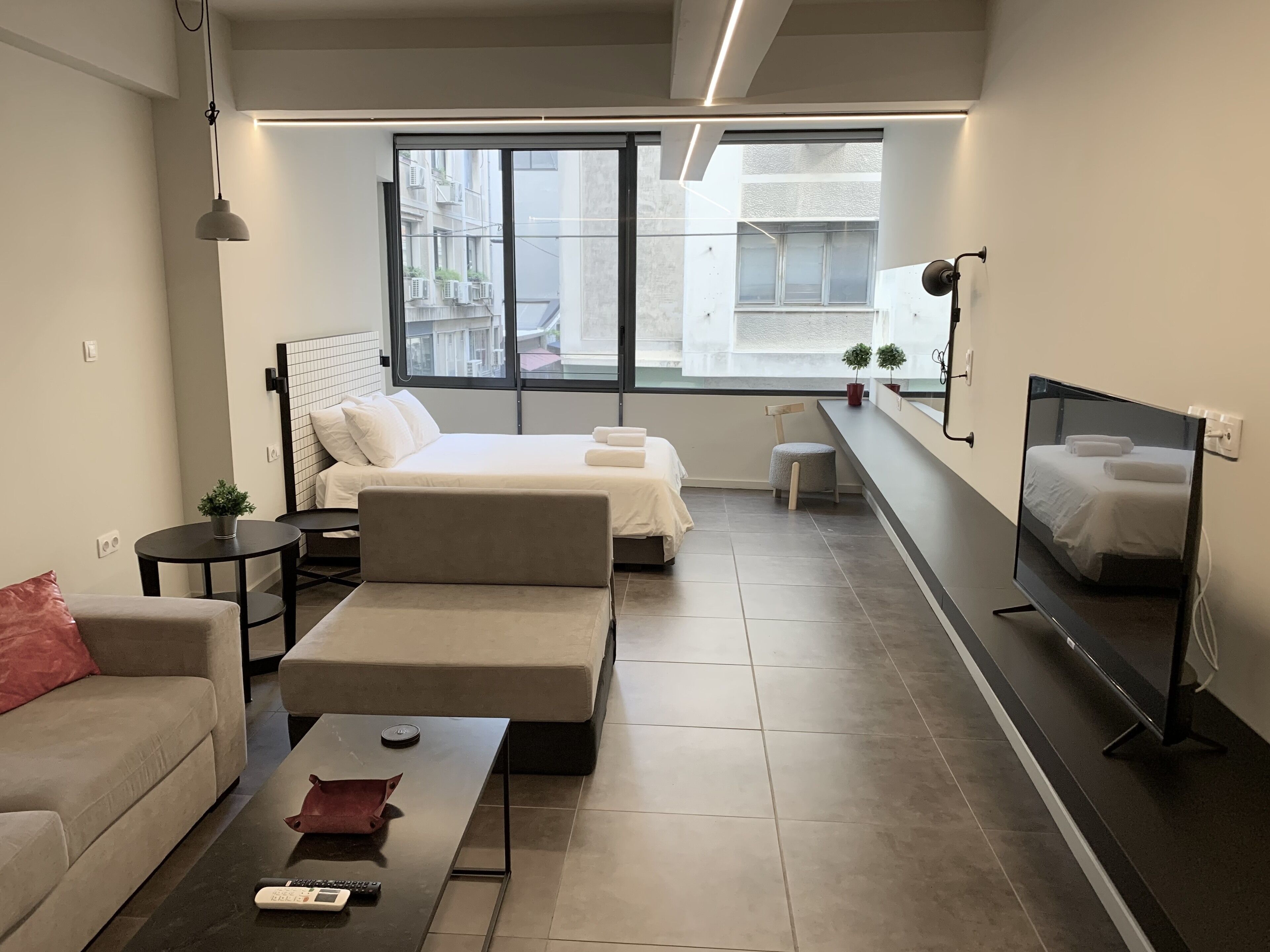 Habitación cuádruple Deluxe | Vista a la ciudad