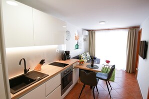 Kylskåp, ugn, spishäll och diskmaskin