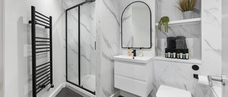 Hair dryer, towels, soap, shampoo