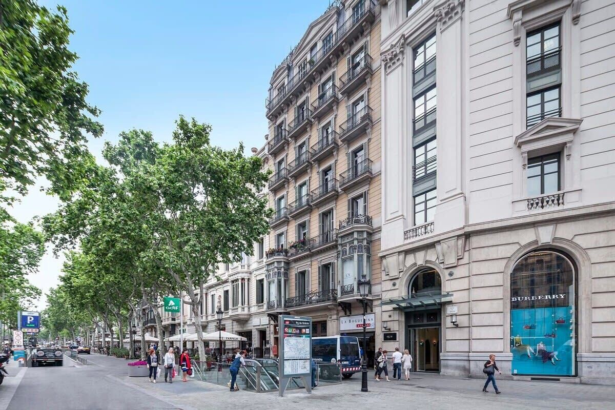 A street view with a row of buildings, including a Burberry store.