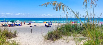 Oceanfront retreat with a scenic balcony, W/D, and AC - beach and pool access