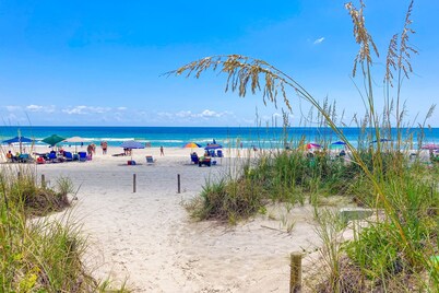 Oceanfront retreat with a scenic balcony, W/D, and AC - beach and pool access