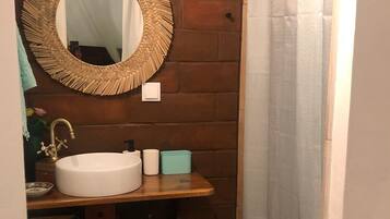Shower, hair dryer, towels, toilet paper