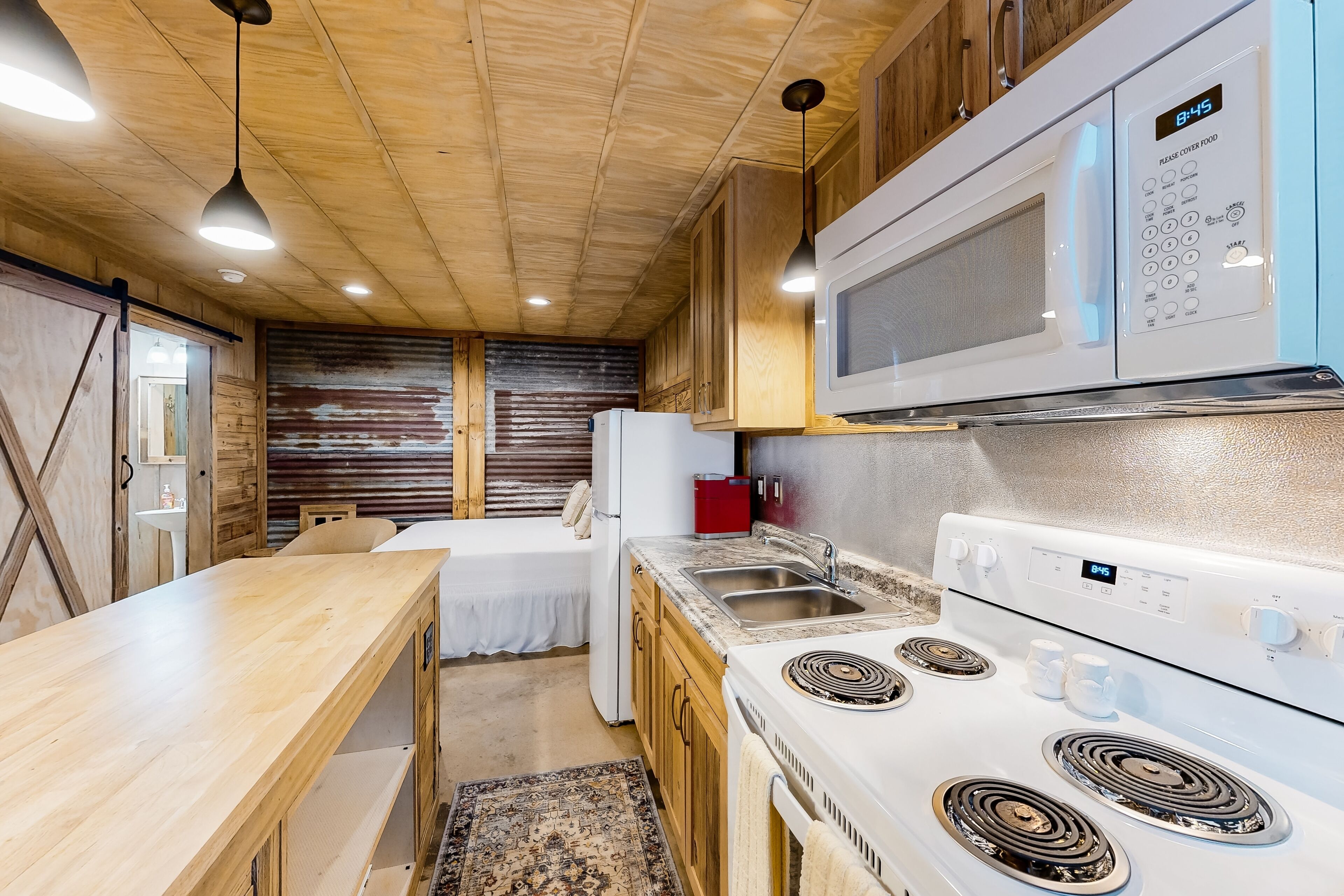 Rustic studio apartment with kitchenette, convenient location, & central AC