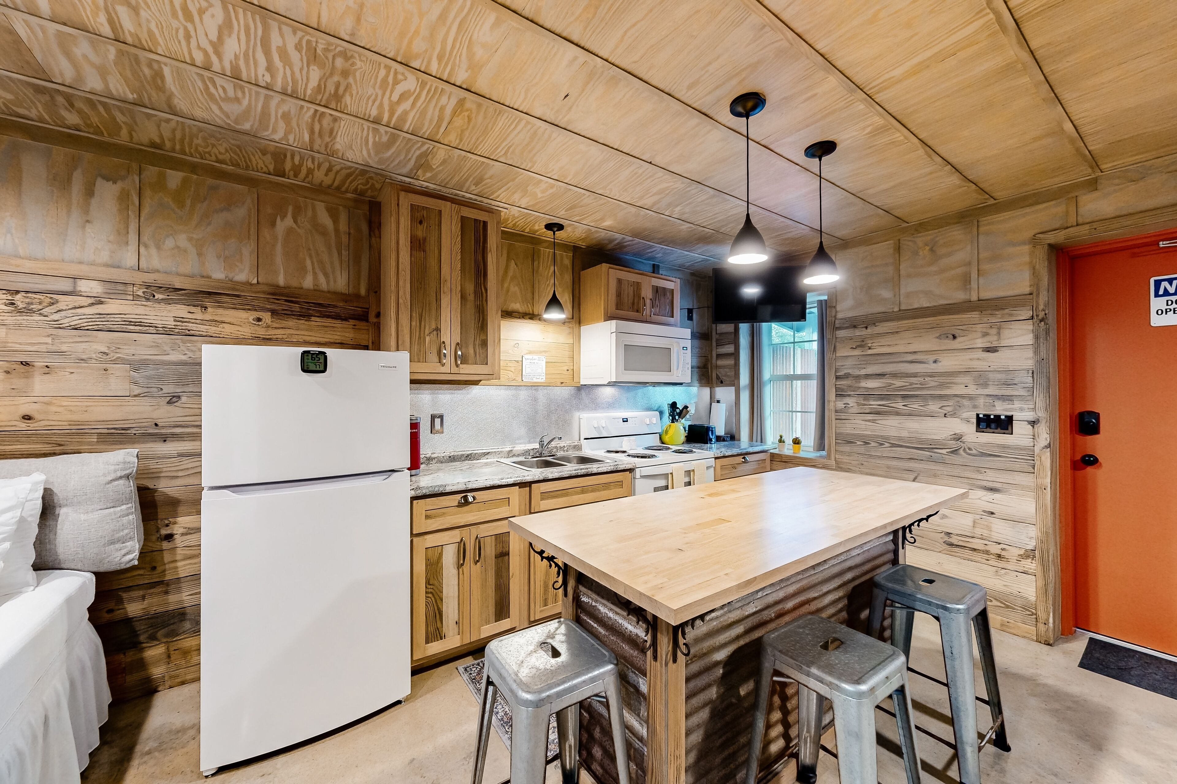 Rustic studio apartment with kitchenette, convenient location, & central AC