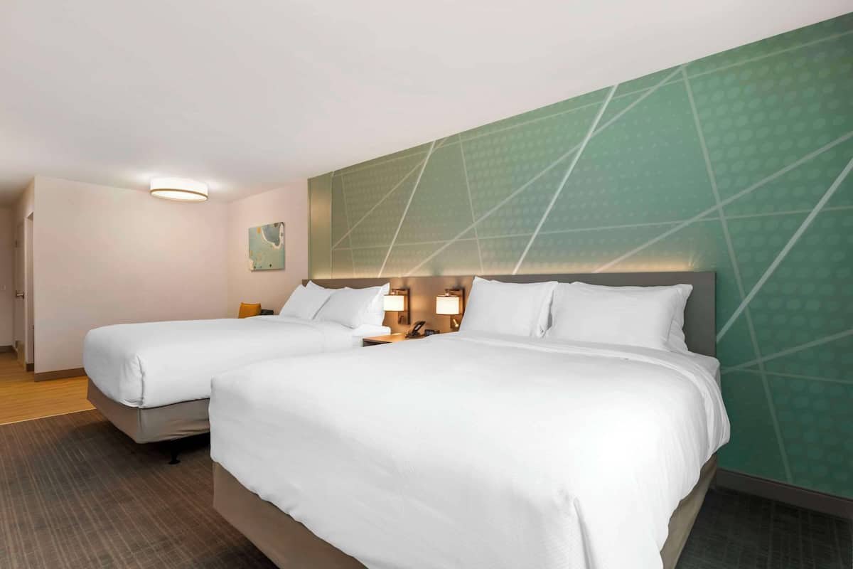 Premium bedding, down comforters, pillowtop beds, in-room safe