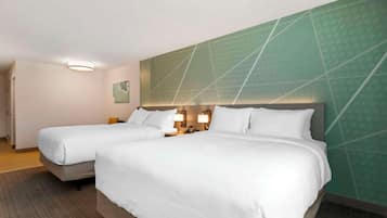 Premium bedding, down comforters, pillowtop beds, in-room safe