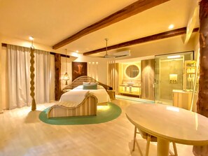 A hotel room with a bed, bedside table, and a round table. - Hotel Shibari Tulum (Tulum)