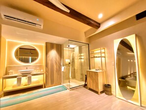 A modern bathroom with a vanity, mirror, and glass shower enclosure. - Hotel Shibari Tulum (Tulum)