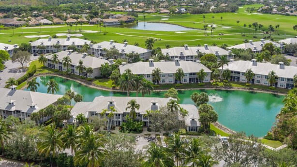 A resort with multiple buildings, a central water feature, and well-maintained lawns. - Lely Greenlinks 2nd Floor - on Golf Course, Minutes from Beaches, Downtown! (Naples)