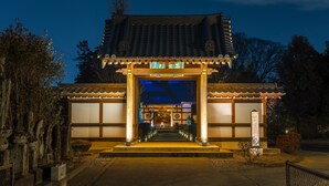 A traditional Japanese building with a tiled roof, wooden beams, and a stone lantern. - TEMPLESTAY ZENSO (Chiyoda Town, Oura District)