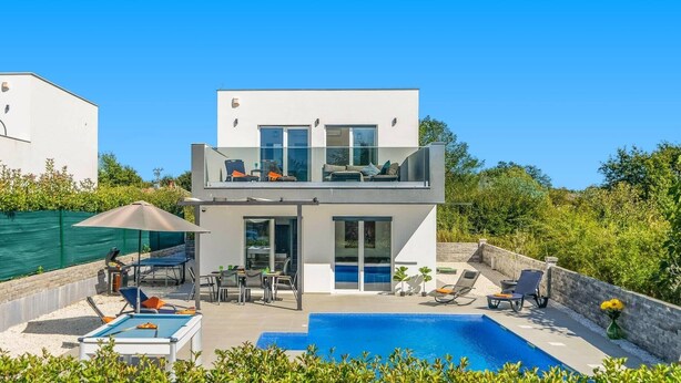 A two-story modern house with a swimming pool, outdoor seating, and a covered patio area. - Villa Lavandula by Villa Plus (Stokovci)