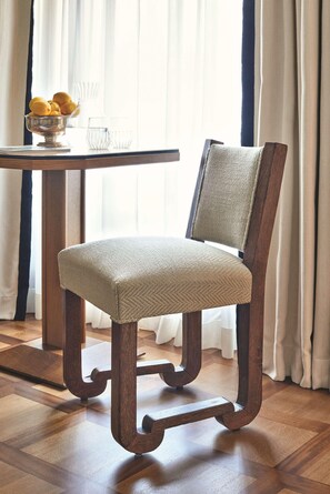 A wooden chair with a woven seat and backrest, positioned next to a table with a bowl of lemons and glasses. - Splendido Mare, A Belmond Hotel, Portofino (Santa Margherita Ligure)