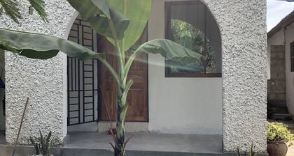 10 mins away from the beach! Family sized plantain house