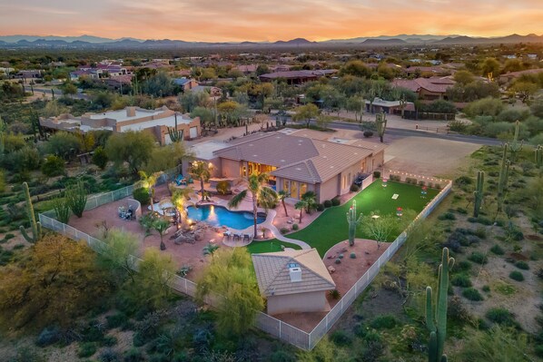 An aerial view of a residential area with houses, a swimming pool, and landscaped gardens. - Desert Oasis ★Pool-Spa-Disc Golf-Ping Pong-Poker Table-Pool Table★ (Scottsdale)
