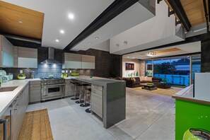 Fridge, stovetop, cookware/dishes/utensils, dining tables