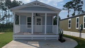 A single-story house with a porch and a covered entryway.