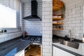 Design Condo, 3 Bedrooms, Terrace, City View | Private kitchen | Full-sized fridge, stovetop, high chair, cookware/dishes/utensils