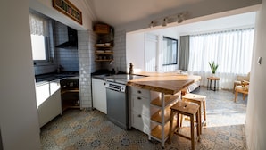 Design Condo, 3 Bedrooms, Terrace, City View | Private kitchen | Full-size fridge, stovetop, highchair, cookware/dishes/utensils