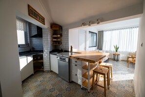 Design Condo, 3 Bedrooms, Terrace, City View | Private kitchen | Full-sized fridge, stovetop, high chair, cookware/dishes/utensils