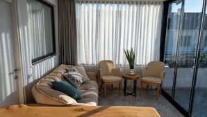 Design Condo, 3 Bedrooms, Terrace, City View | Living area | 128-inch TV with premium channels