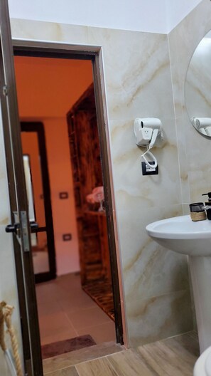 Shower, rainfall showerhead, designer toiletries, hair dryer