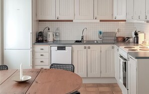 Fridge, stovetop, dishwasher, coffee/tea maker