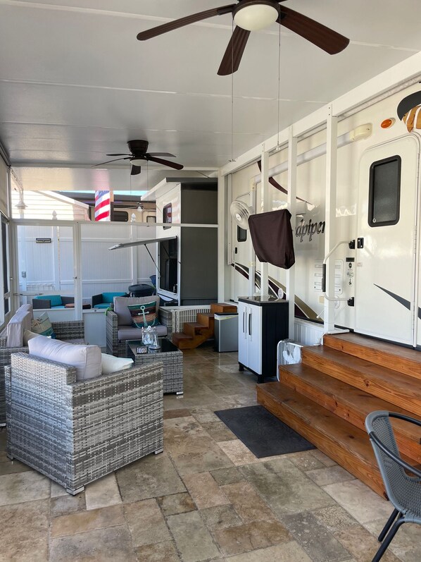 A spacious RV interior with a living area, kitchenette, and sleeping quarters. - Relax in Calusa Key Largo (Key Largo)