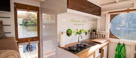 Fridge, stovetop, coffee/tea maker, cookware/dishes/utensils