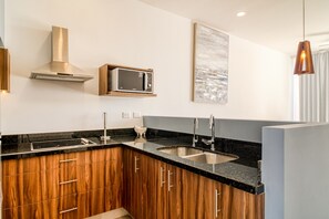 Fridge, microwave, stovetop, coffee/tea maker