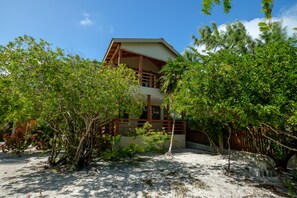 Exterior - Beachfront abode with well-equipped kitchen - pool, beach, grill, & canoe access (Caye Caulker)