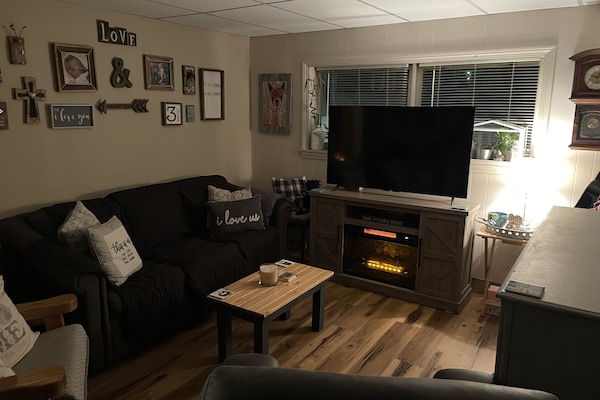 Living Room- Homey, Cozy, and Decorated with my family photos.