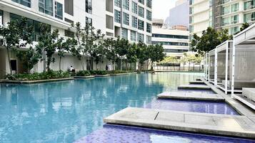 2 outdoor pools, open 7:00 AM to 10:00 PM, pool umbrellas, pool loungers